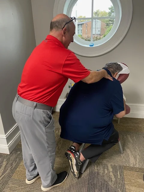Seated chair massage focusing on the neck and shoulders