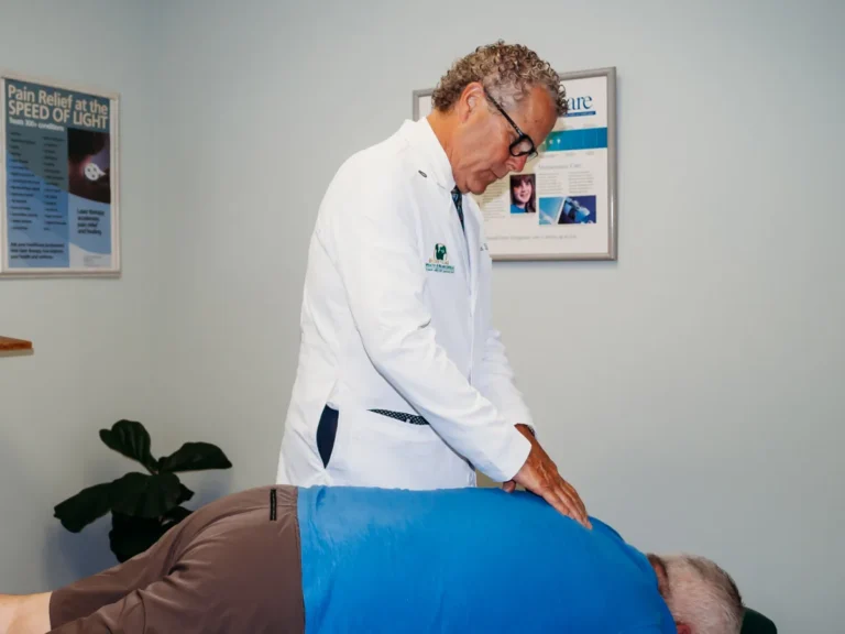 Dr. Brent Ungar performing a chiropractic adjustment on a patient at Belden Village Chiropractic and Wellness Center in Canton, OH