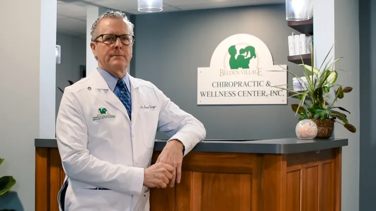 Dr. Brent Ungar at the front desk of Belden Village Chiropractic and Wellness Center in Canton, OH